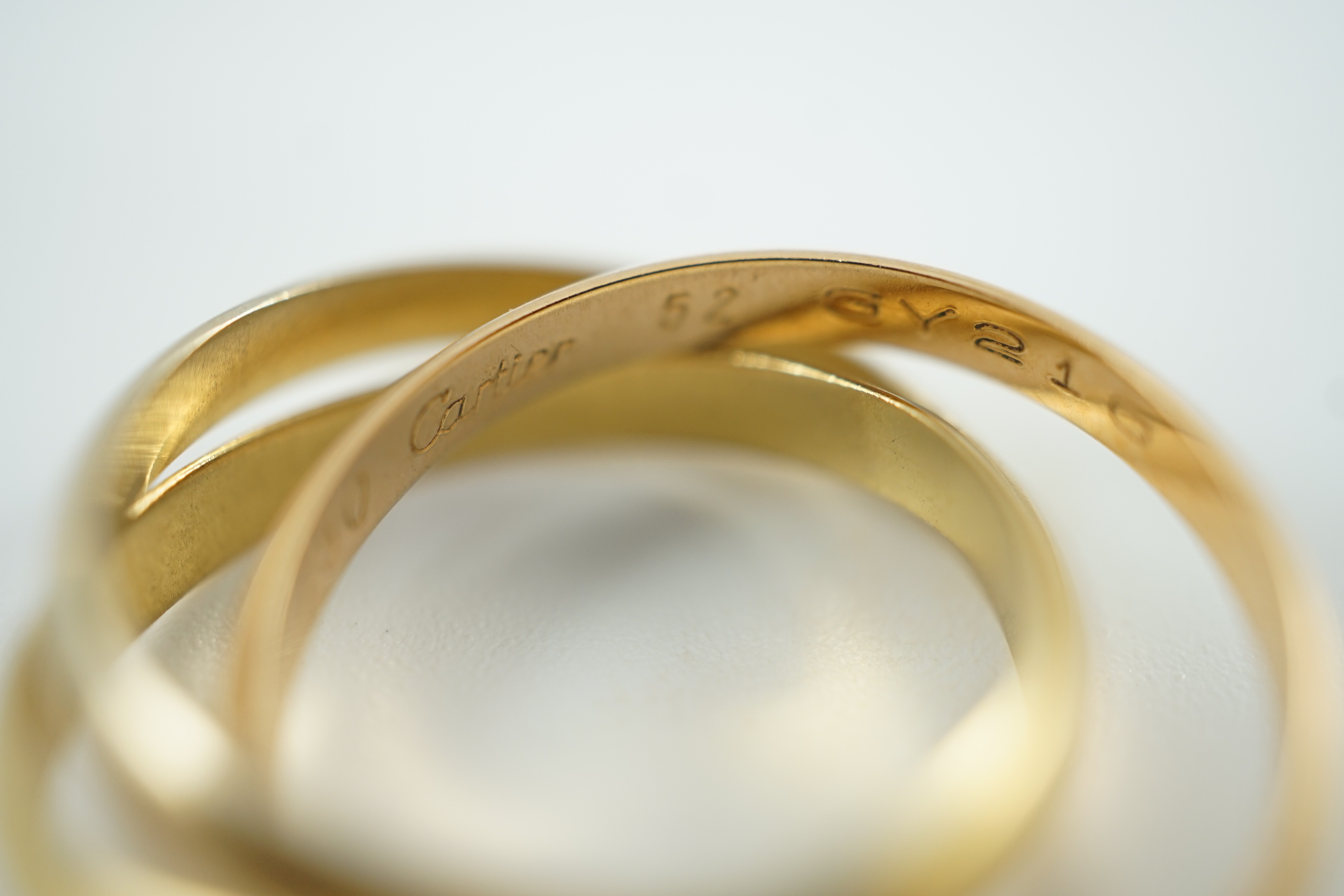 A modern 18ct three colour Cartier 'Russian' triple wedding band